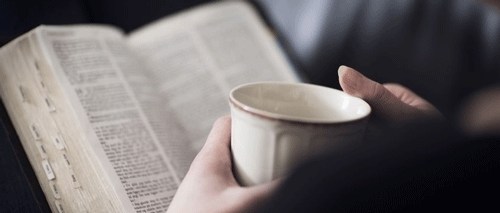Bible and coffee cup